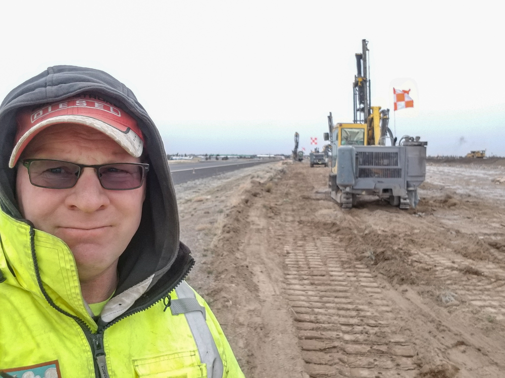 Owner Matt Higgins stands in front of a job site for Quality Drilling and Blasting